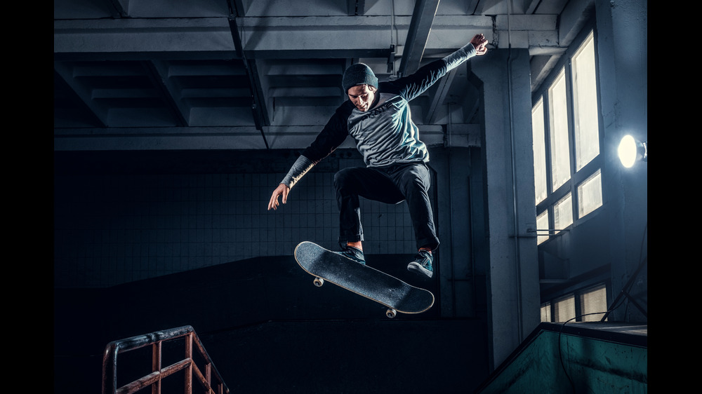 man jumping in indoor skating